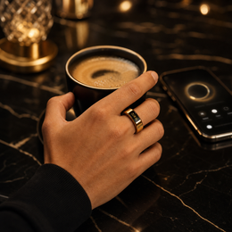 DROPPD Aura Touch Smart Ring worn during a premium coffee lifestyle moment